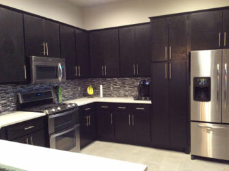 Kithen with dark wood and new appliances